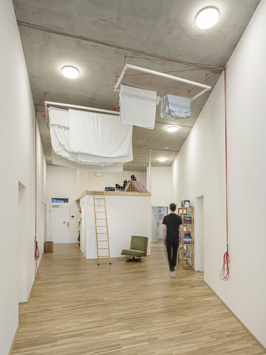 Quartiershaus Am Stadtbalkon / Feld72-インテリア写真、木材、照明